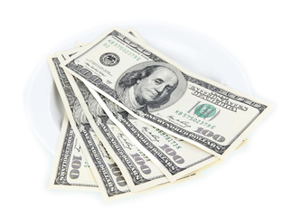 Money on plate isolated on white