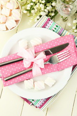 Table setting in white and pink tones