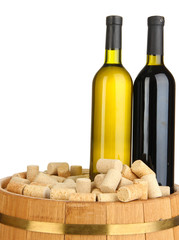 Naklejka premium Wine and corks on barrel isolated on white