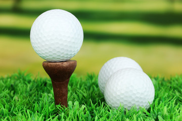 Golf balls on grass outdoor close up