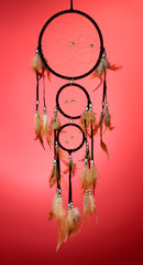 Beautiful dream catcher on red background