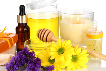 Obraz na płótnie Canvas Fragrant honey spa with oils and honey isolated on white