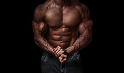 Bodybuilder isolated on black background