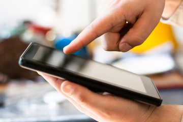 Hands with tablet computer