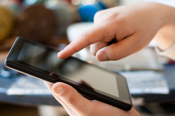 Hands with tablet computer