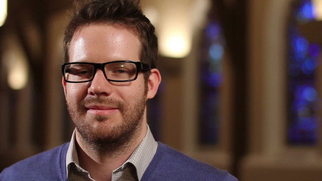 Man at church, looking at camera