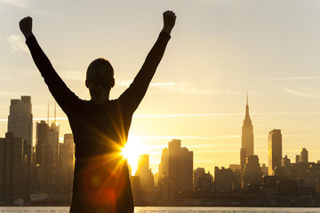 Fototapeta na wymiar Successful Woman Sunrise New York City Skyline