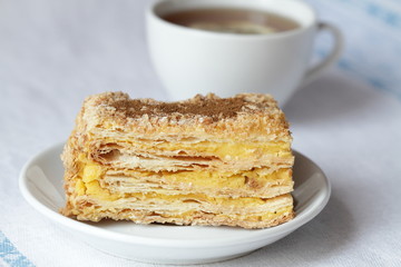 Cake Napoleon and cup of tea