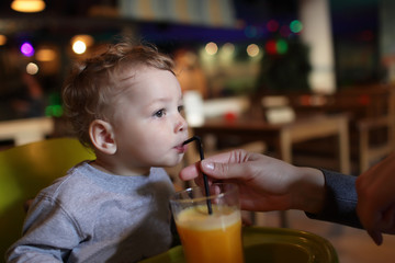 Boy with orange juice