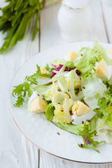 Fresh salad greens with eggs