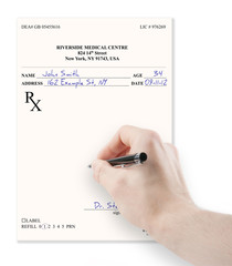 Doctor filling in empty medical prescription isolated