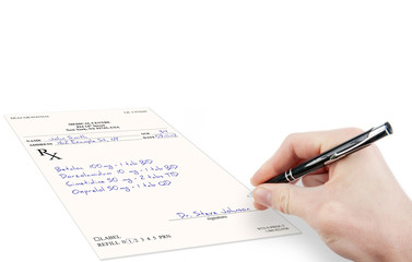 Doctor filling in medical prescription isolated