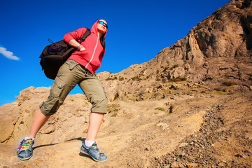 tourist climbs on the way to the mountains