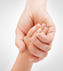 Mother holding child's hand