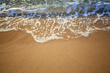 Soft wave of the sea on the sandy beach