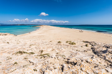 Tourists in Illetes beach Formentera island, Mediterranean sea,