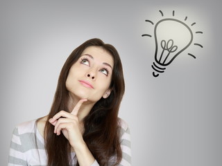Thinking beautiful woman with idea bulb lamp above isolated on g
