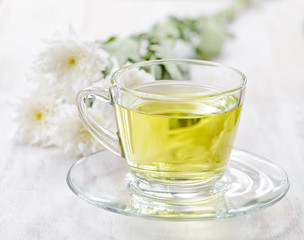 Cup of herbal tea and flowers