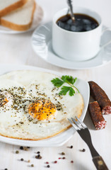 Fried eggs with sausage