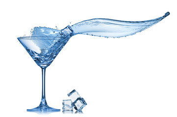 Martini splash in glass isolated on white