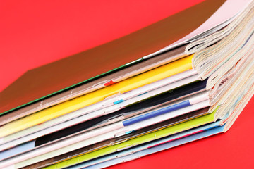 Many magazines on red background