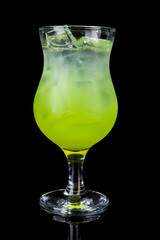 green alcholol cocktail isolated on black in hurricane
