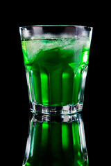 Melon ball alcohol cocktail isolated on black