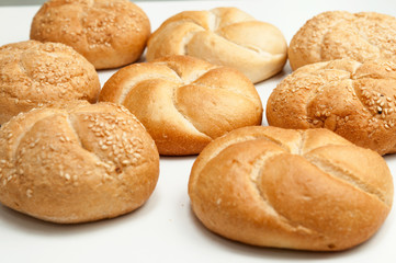 Close up of fresh rolls bread with sesame seeds from the oven