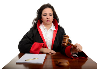 Angry female judge striking the gavel and pronounces sentence