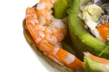 Seafood salad with red caviar in avocado