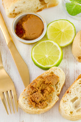 sardine paste on bread with lime and water
