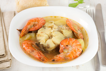 fish stew in white plate