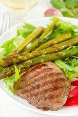 fried beef with boiled asparagus and salad