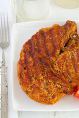 fried alheira in dish with fork