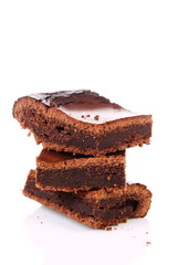 Slices of a brownie on white background