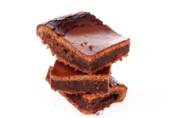 Slices of a brownie on white background