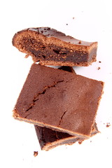 Slices of a brownie on white background
