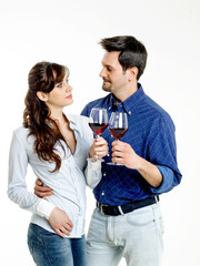 Young couple celebrating with red wine