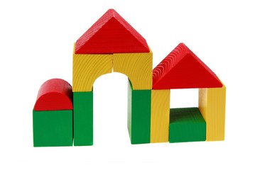 houses made from colorful wooden building blocks. isolated on wh