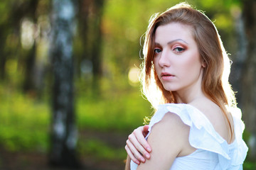 thoughtful woman in the park