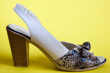 Women's summer shoes on a yellow background