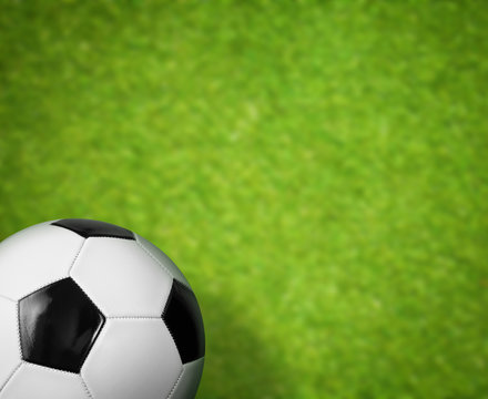 green grass soccer field and ball background
