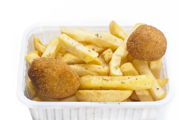close up of basket of fries and arancini