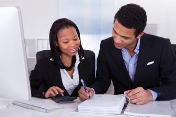 Two Business People Doing Finance Work