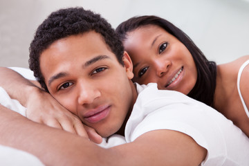 African Couple Looking At Camera