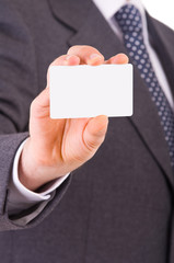Business man showing blank card.