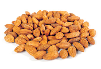 Seed of almonds nuts over white