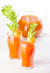 Fresh carrot and pumpkin juice on white background