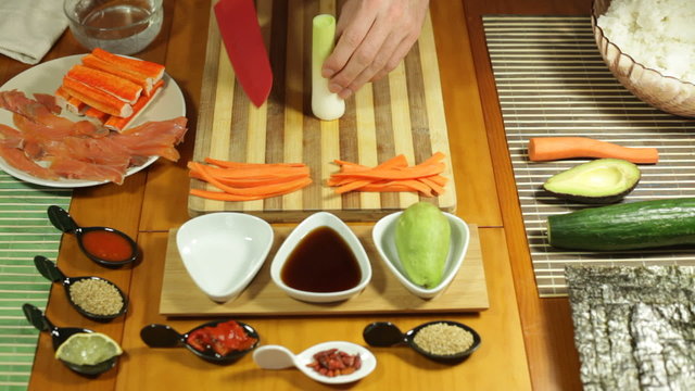 Chopping spring onion for making Sushi roll