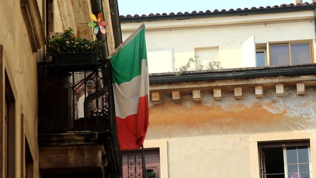 Italian flag in front of a historical cladding